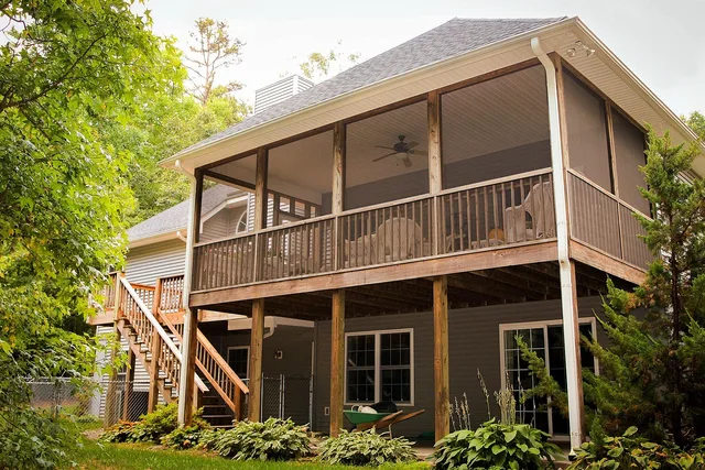 back porch, rear porch, back patio, rear patio, deck, backyard, rear elevation, house, home, hostas, staircase, stair, rear entrance, residence, screened porch, brown home, deck, deck, deck, deck, deck, backyard. Deck and patio marketing: channels, rules and metrics