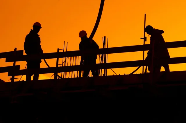 construction site, workers, construction worker, construction, to build, building, construction site, construction site, workers, workers, construction worker, construction worker, construction worker, construction worker, construction, construction, construction, construction, construction. Labor costs for a deck and patio crew come down to how pay is set